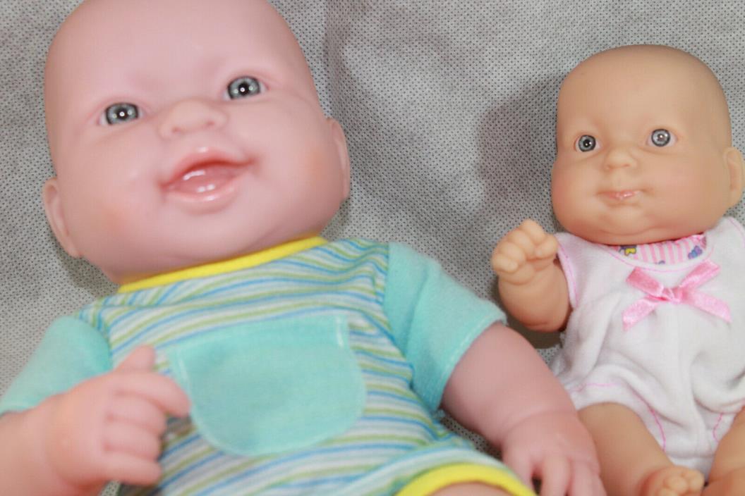 Two Berenguer baby dolls, 12 inch and 8 inch sizes.