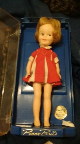 Penny Brite in red dress blue case vintage