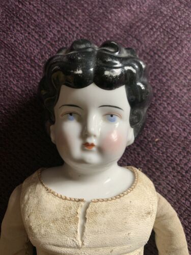 Lovely antique German, brunette china doll With old cloth body