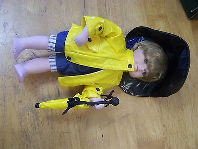 Geppeddo Porcelain Boy Doll in Yellow Rain Suit with Umbrella