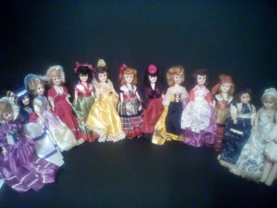14 girl DOLLS with colorful silken outfits, with sleep eyes.  DISCOUNTED