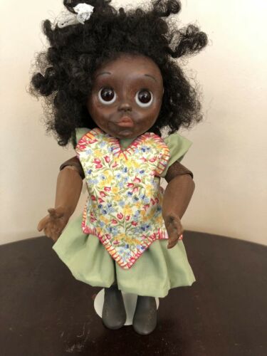FRED THOMPSON CARVED BLACK CHILD