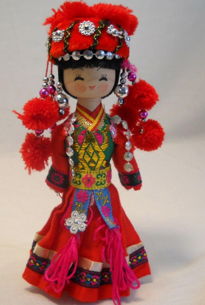 Chinese Wooden Doll In Colorful Dress And Hat