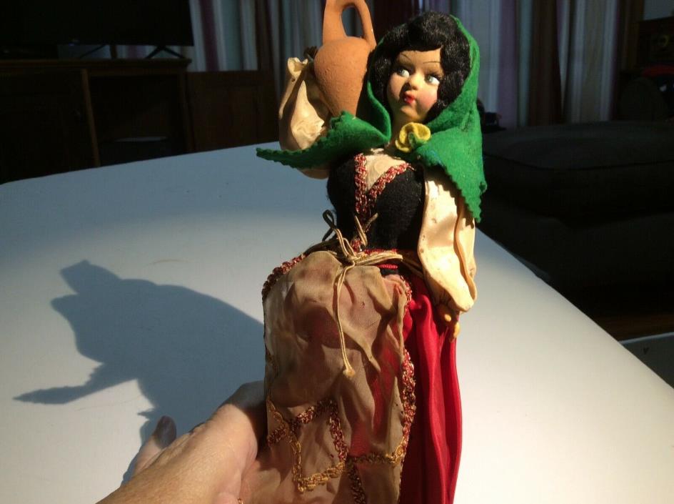 10” Spanish peasant girl carrying olive oil jug. International doll c. 1950s