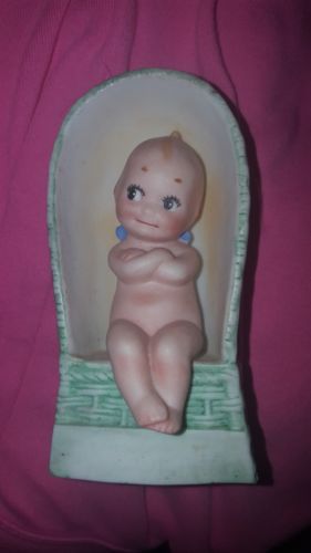 Adorable Bisque Kewpie in Green Wicker Chair