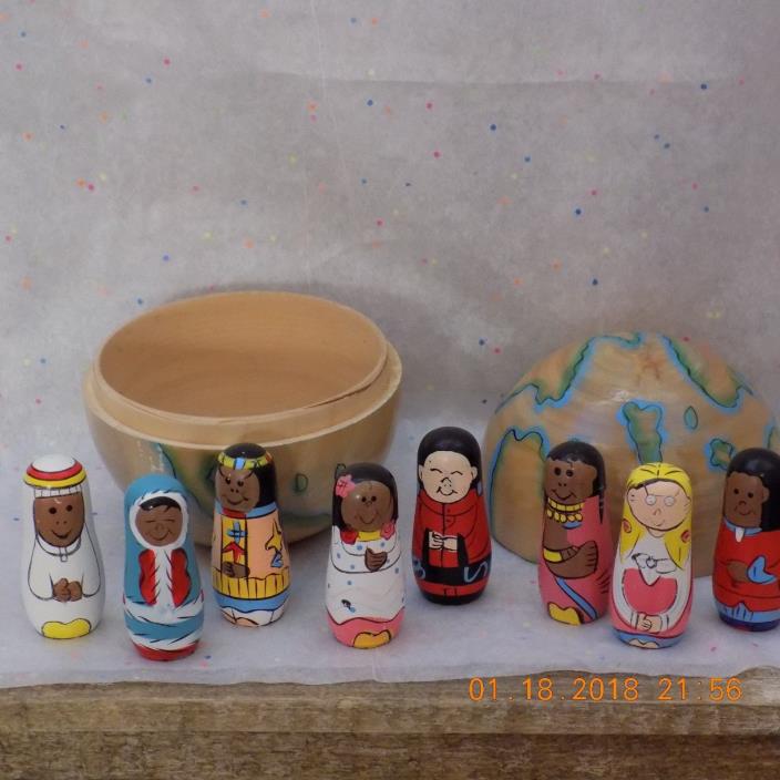 wooden hand painted nesting world with children from all over the world