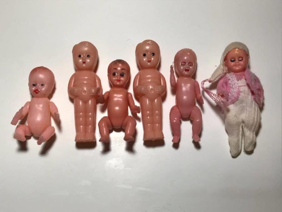 Set of 6 miniature plastic dolls