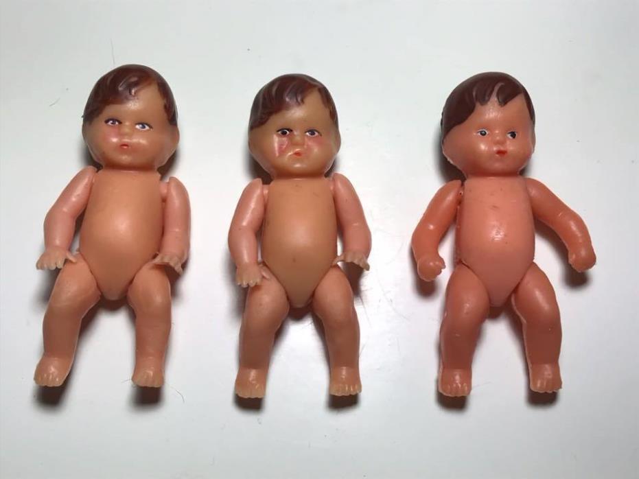 Set of 3 miniature rubber dolls