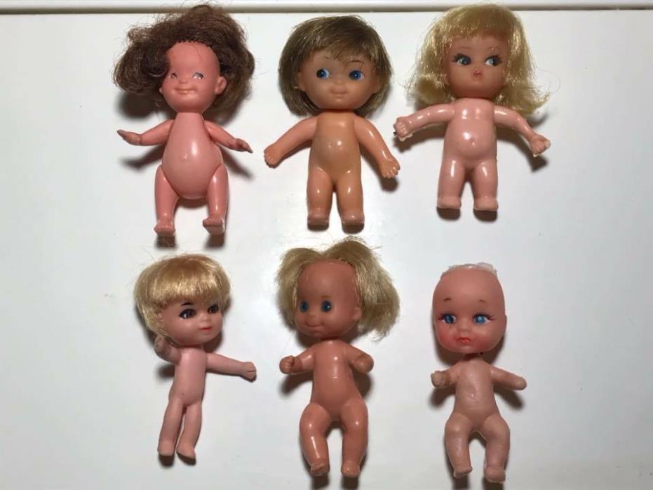 Set of 6 miniature rubber dolls