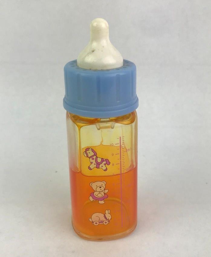 Vintage Magic Disappearing Orange Juice Baby Doll Bottle Plastic Blue Lid
