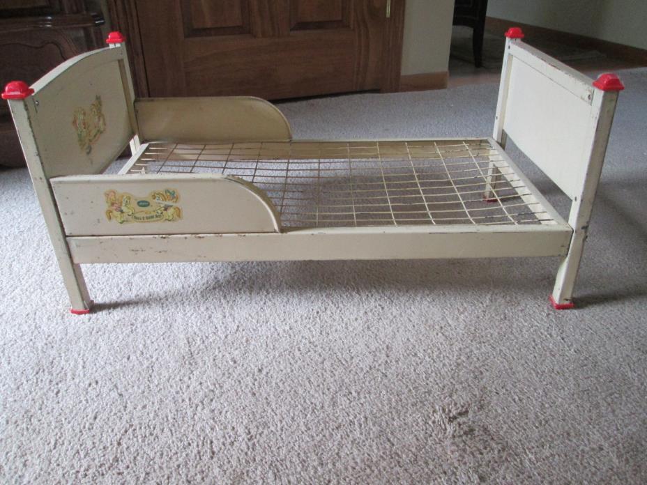 Vintage 1950  Metal Doll Bed with metal spring,{ Original paint  and decals}