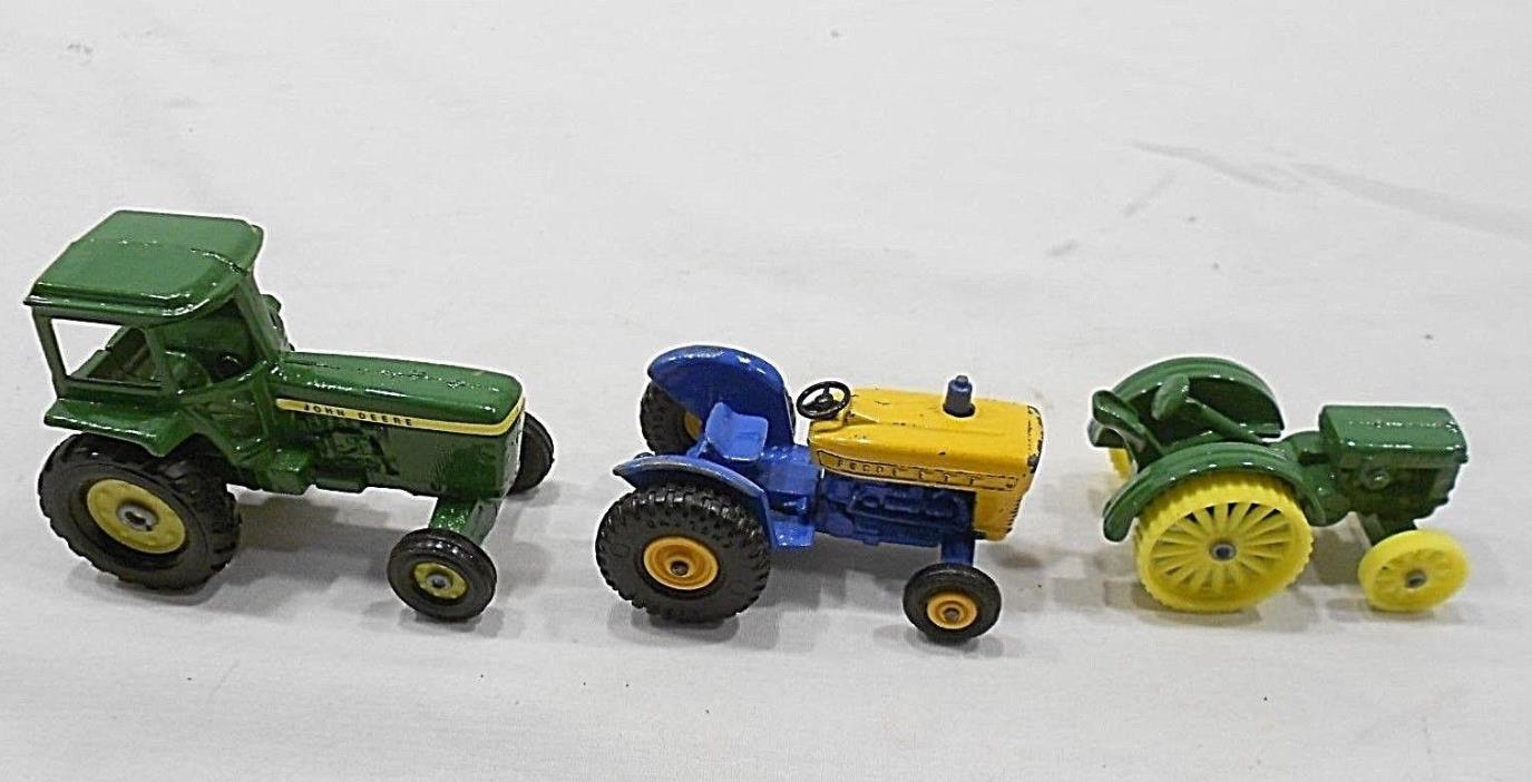 TOY TRACTORS, LOT OF 3, ONE MATCHBOX SERIES 19 FORD,TWO JOHN DEERE