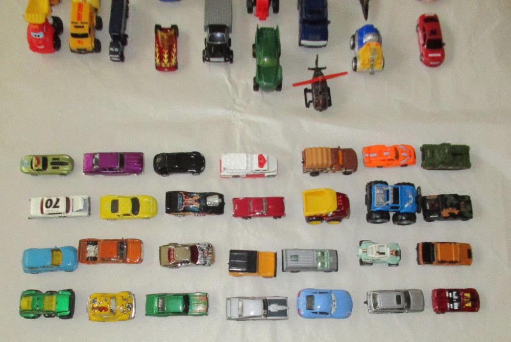Lot of 59 of Toy Cars, Trucks, a Helicopter, a Plane, a Tank and a Tractor.