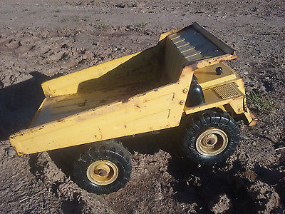 Yellow Metal Dump Truck Goodyear Super Terra Grip Tires 1986 REMCO Toys, Inc.