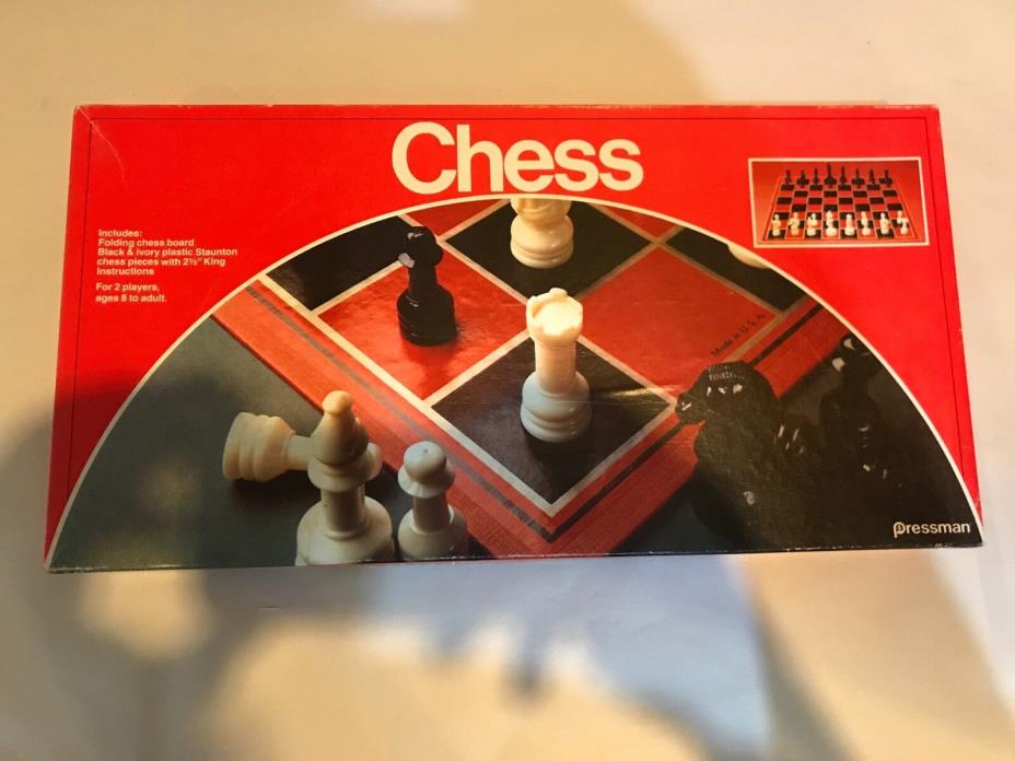 PRESSMAN FOLDING CHESS BOARD W/ CHESS AND CHECKERS PIECES.