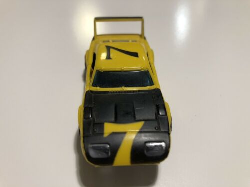 Aurora AFX Dodge Daytona flamethrower yellow black #7  slot car