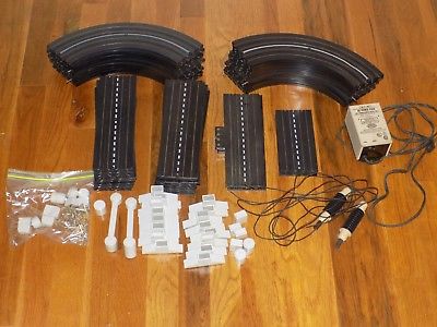 Aurora Model Motoring Slot Car Lot- 54 tracks controllers and power supply