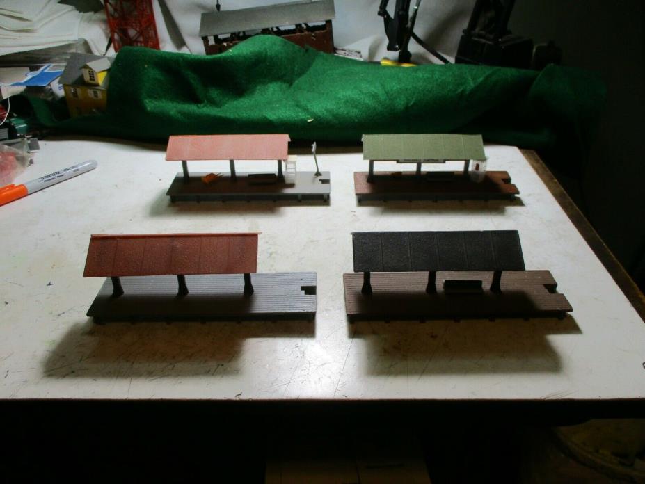 4 H.O. SCALE STATION PLATFORMS. ALL EXCELLENT CONDITION. 2 WITH TELEPHONE BOOTHS