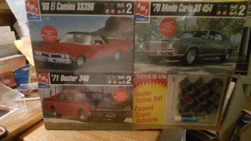 AMT ERTL3 and1 plus pack 68 Elcamino ss396,70 Monte Carlo ss454 and 71 Duster340