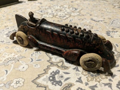 A. C. Williams Cast Iron Boat Tail Racer w/ Driver Embossed Pistons 8.5