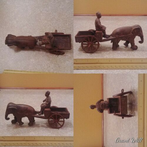 Elusive Elephant cast iron collectible cart ridden by man. c1900