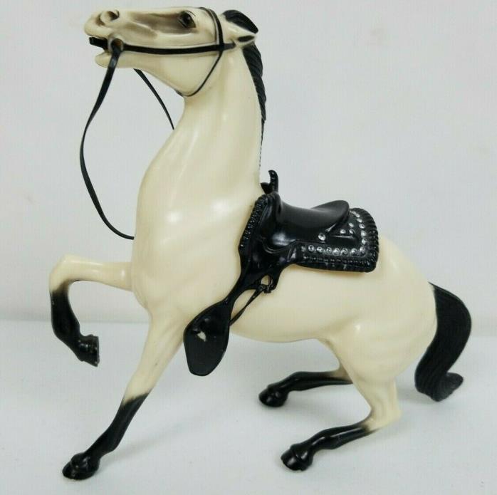 Vintage plastic horse with removable saddle and martingale