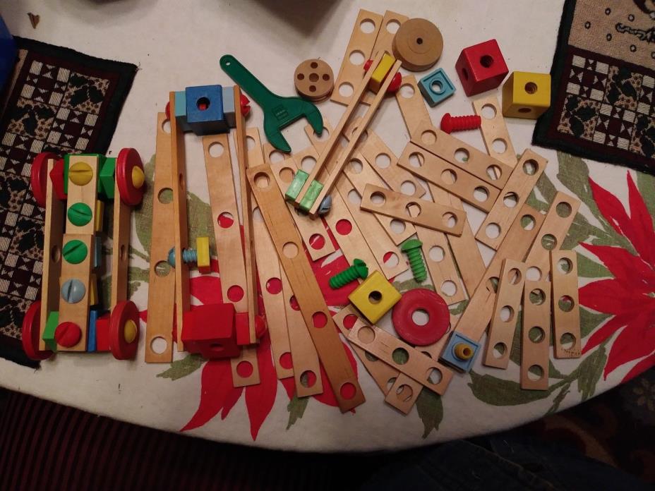 Wooden Erector Set with Plastic Nuts and Bolts, no box or container.
