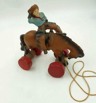 VINTAGE GERMAN COMPOSITION? PULL TOY COWBOY BOUNCING ON BRONCO SCARCE
