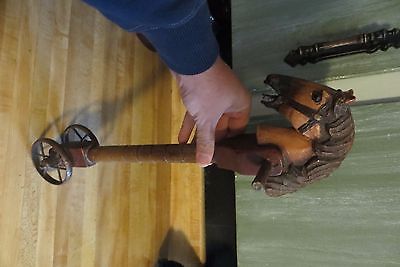 stick type wood push toy,horse with glass eyes,brass wheels,vintage?
