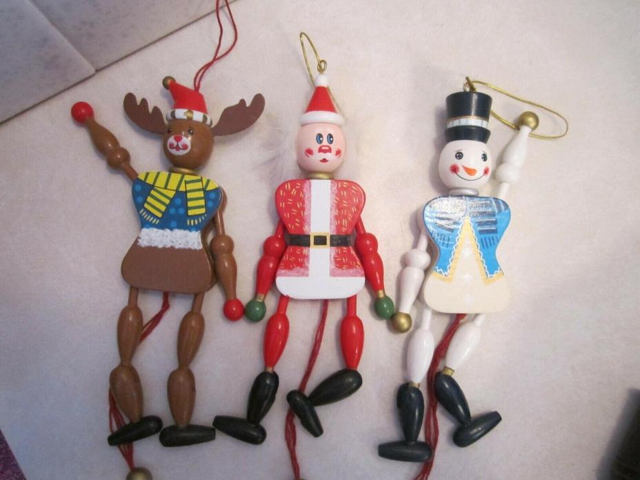 Three wooden jumping-jacks (marionette)  string puppet Santa, snowman, reindeer