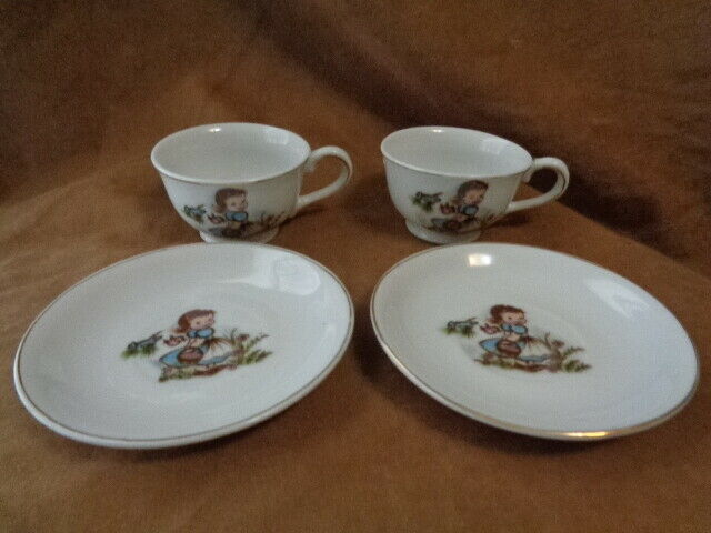 2 Vintage Child’s Play Toy Tea Cup and Saucer Set - LITTLE GIRLS WITH BASKET
