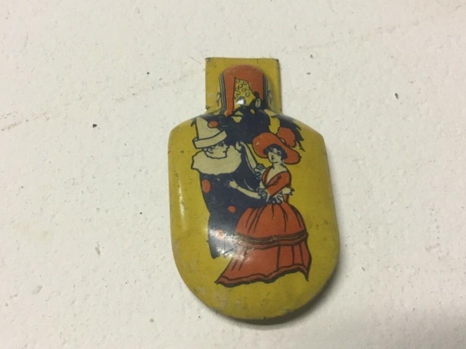Vintage Kirchhoff lady and jester/clown tin toy metal clicker