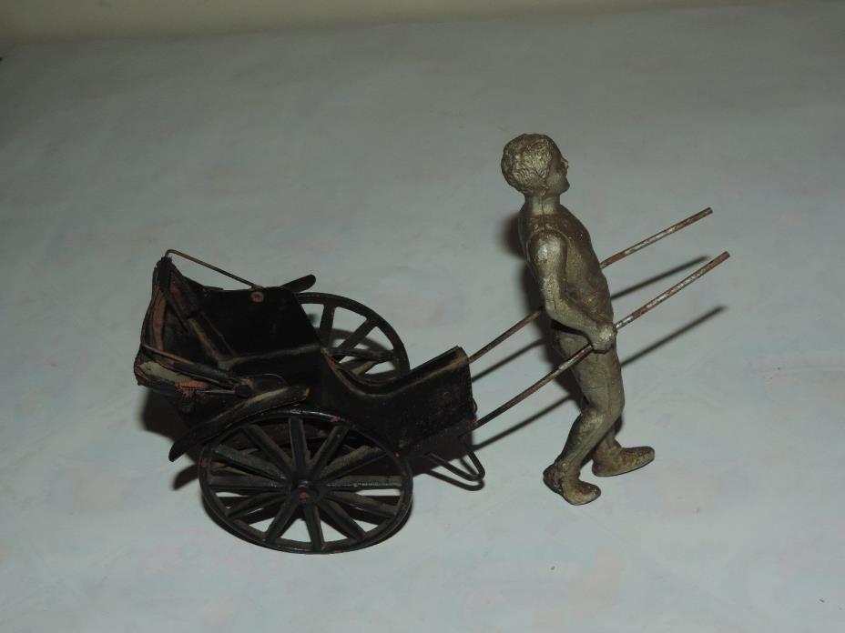 Antique Toy Cast Metal Tin Man Pulling Cart (h537)