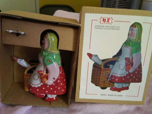 NRFB Reproduction Tin Toy Woman With Goose And Rooster