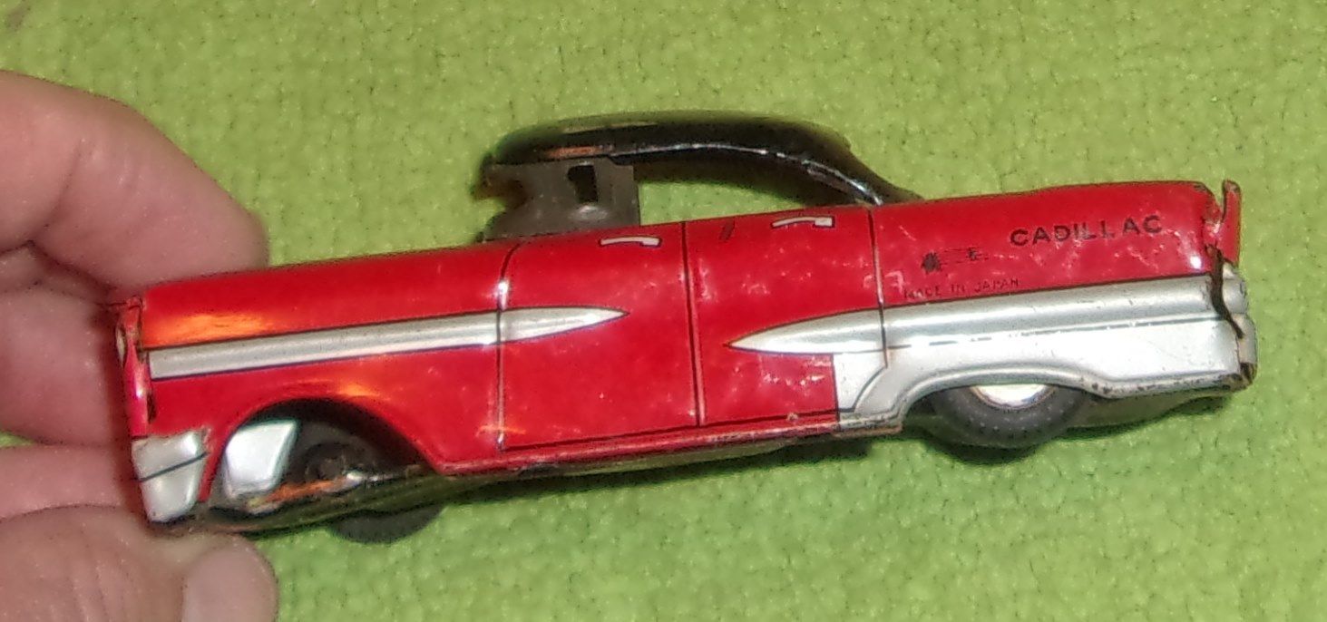 antique made in Japan tin Cadillac toy car red & black collectible display rare
