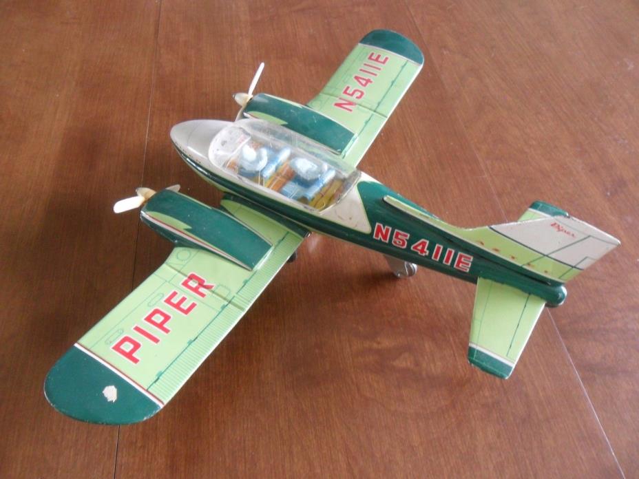 Tomiyama Piper Aztec Japanese tin friction toy airplane