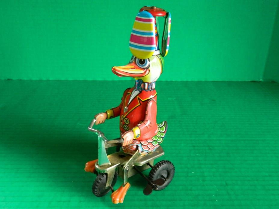 VINTAGE WIND UP TIN TOY, CIRCUS DUCK RIDING TRICYCLE