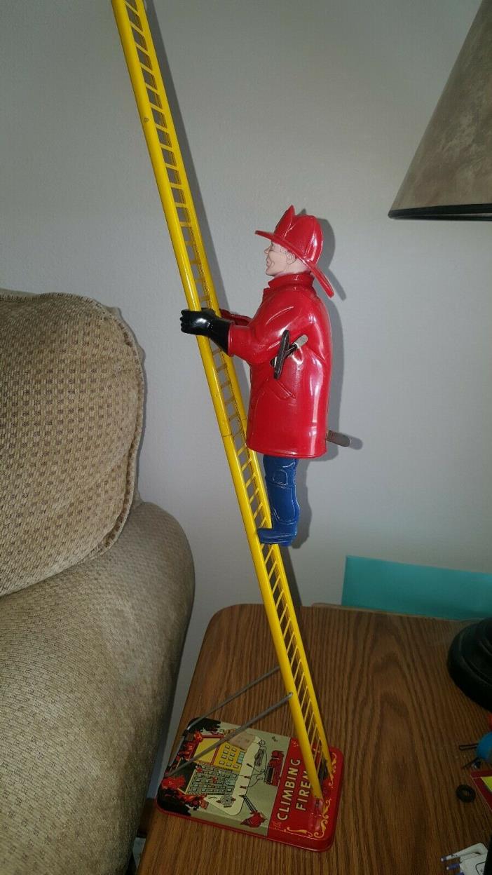 Vintage Marx Wind up climbing fireman with box