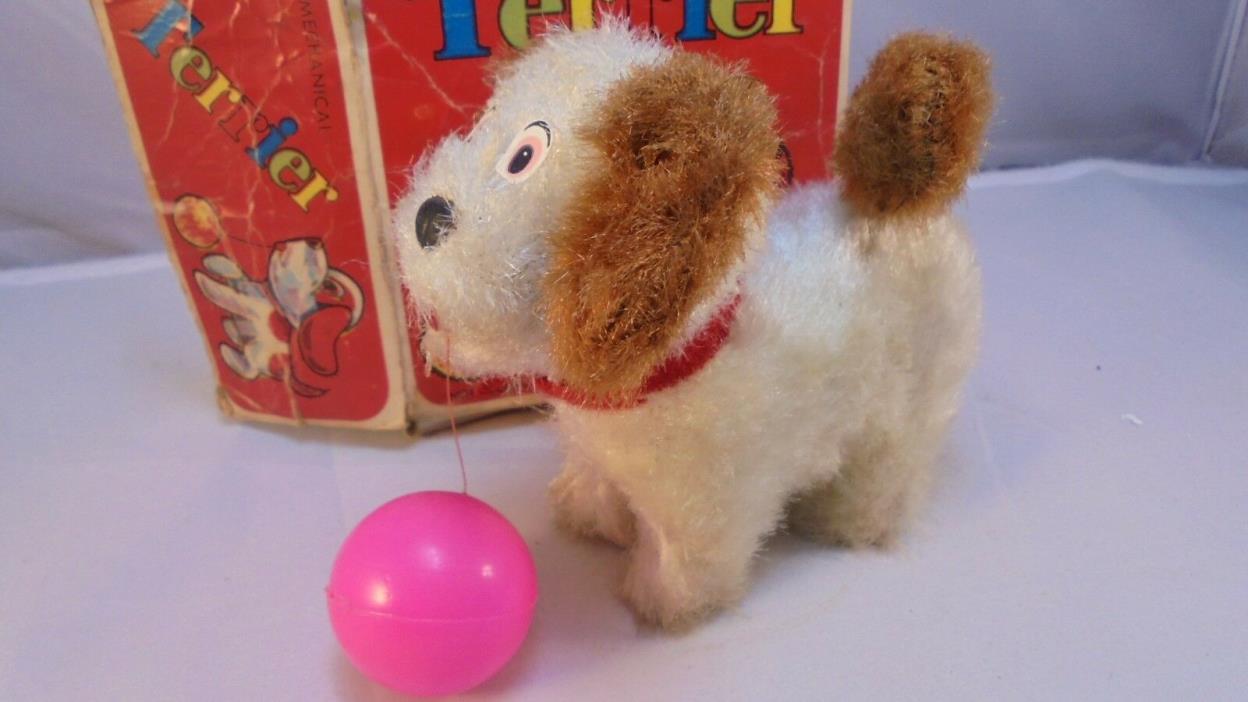 Vintage Mechanical Terrier Wind-up toy dog with spinning tail with original box