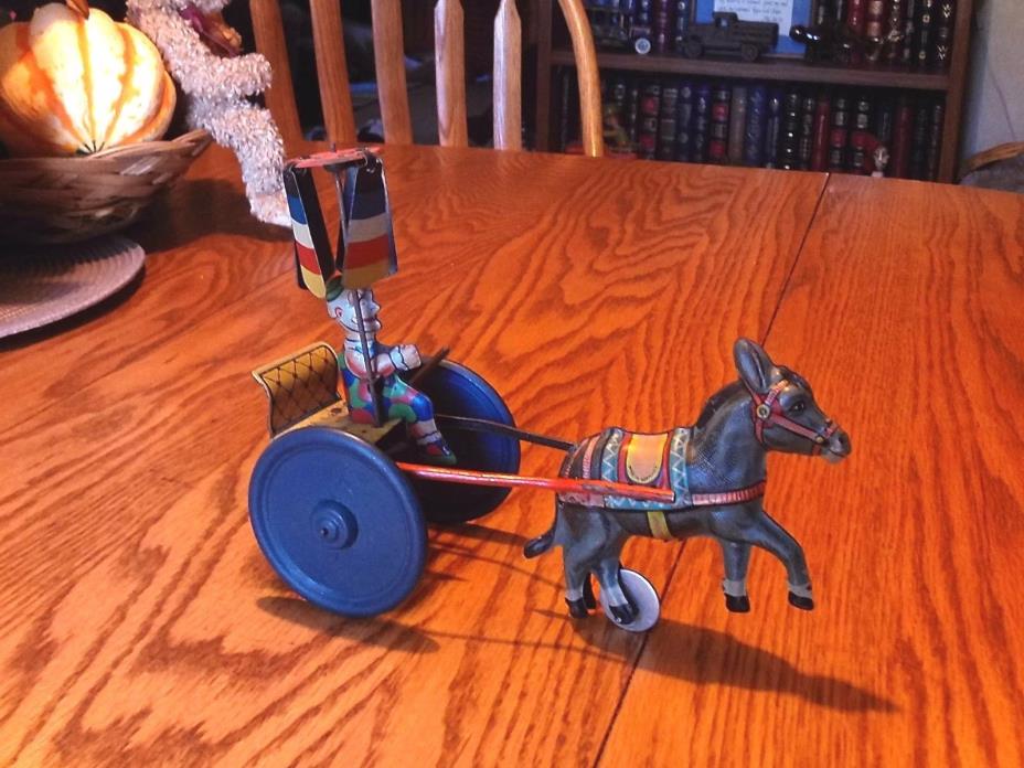 VINTAGE RARE GAMA TIN DONKEY PULLING CLOWN ON CART, LEVER ACTION WIND UP
