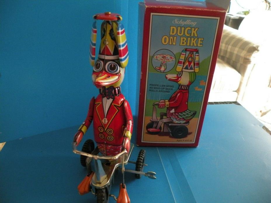 Duck on Bike Wind Up Propeller spins Duck peddles Tin Toy Schylling Md China new