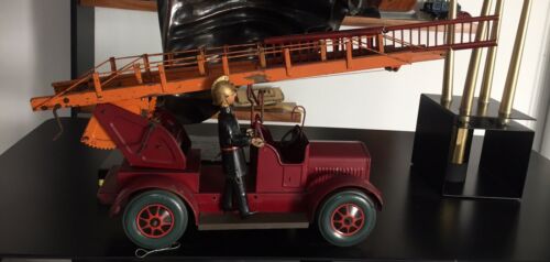 1. Karl Bub Firetruck 1930s?; 2. Fireman Gunthermann 1900s? Tin Toys Germany,