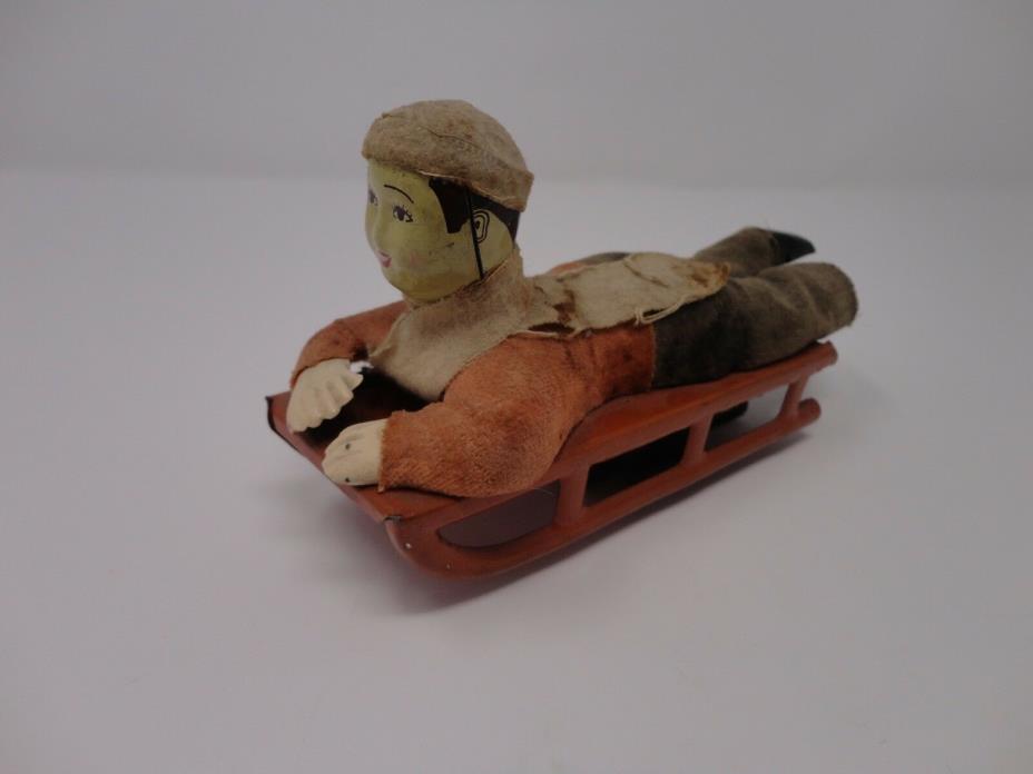 Vintage 1930's Japan Wind Up Mechanical Toy Boy on a Sled 6.75