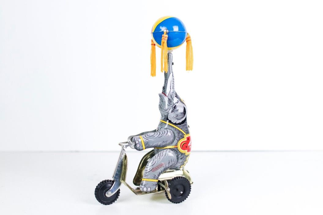 Vintage Wind-up Circus Elephant on Tricycle Tin Toy Winding Spinning Ball