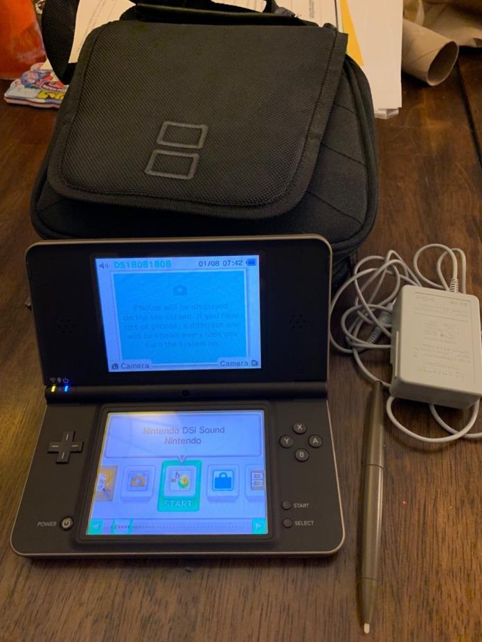 Nintendo DS XL plus carrying case, charger, stylus pen and 10 games