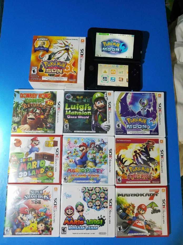 Nintendo 3DS with games Mario Luigi Pokemon Sun Moon console