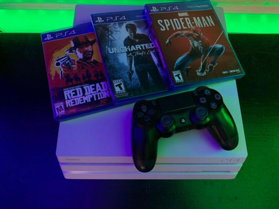 ps4 pro 1tb in excellent used condition with 3 games pictured.