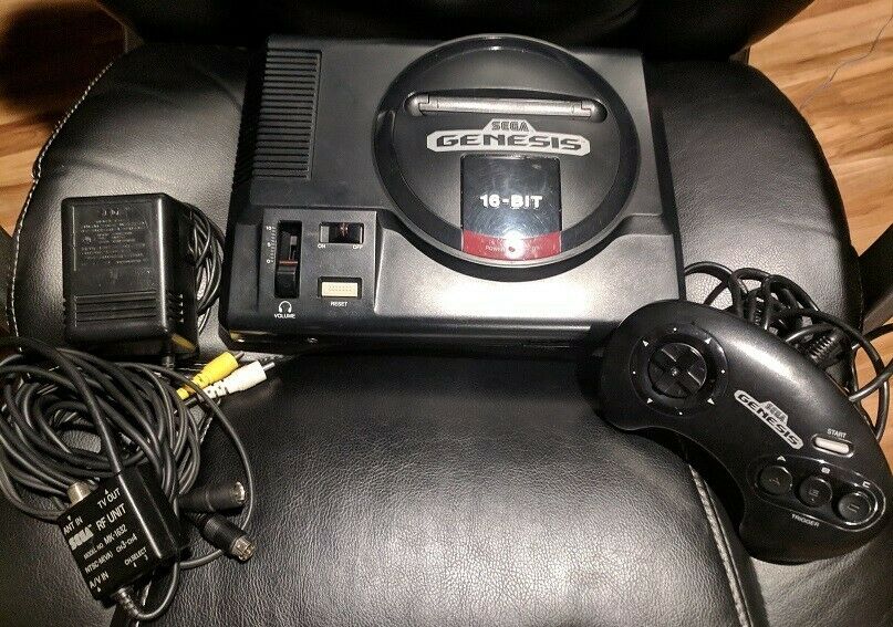 Sega Genesis Model 1 console with AC adapter, AV, 1 controller and 6 games