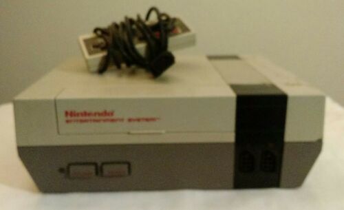 Nintendo NES Console NES-001 and one controller. NOT WORKING FOR PARTS or repair