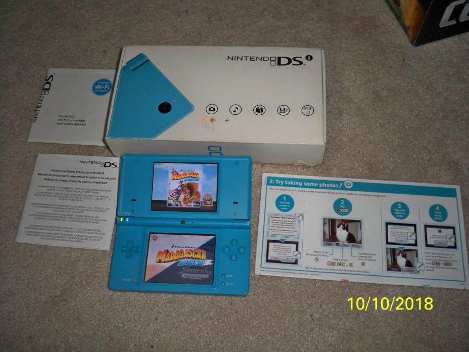 Nintendo DSI with box and inserts
